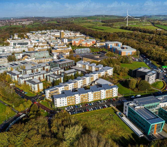 Aerial view of The University of Lancaster's parkland campus with its buildings and surrounding countryside